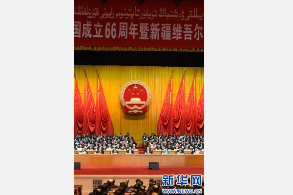 10月1日，慶祝中華人民共和國成立66周年暨新疆維吾爾自治區(qū)成立60周年大會在新疆人民會堂隆重舉行。 新華社記者 高潔 攝 